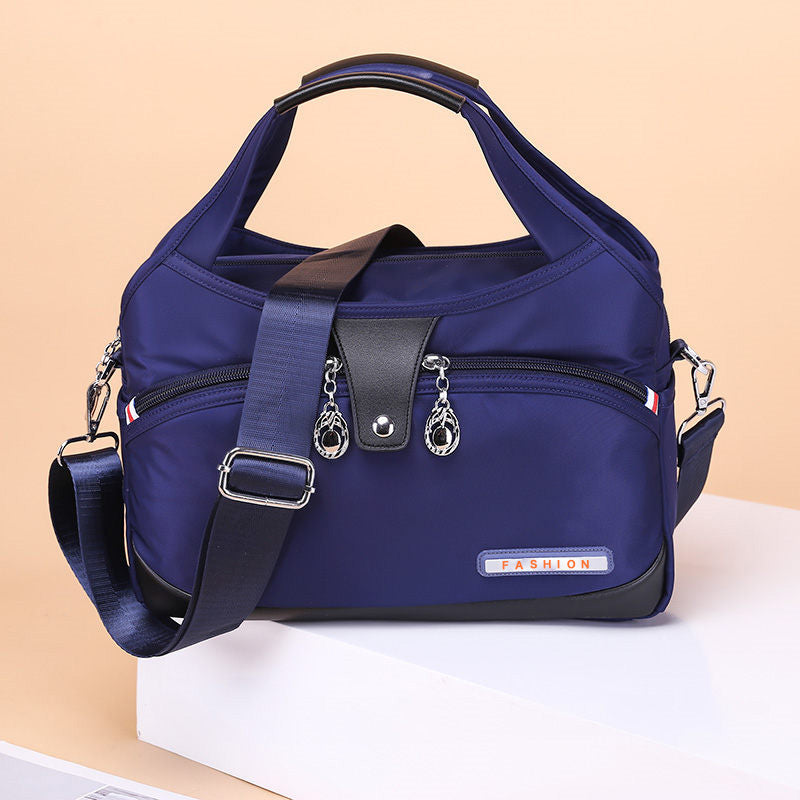 Geantă crossbody antifurt din nailon — design hidrofug, compartimente multiple, funcții de securitate ascunse