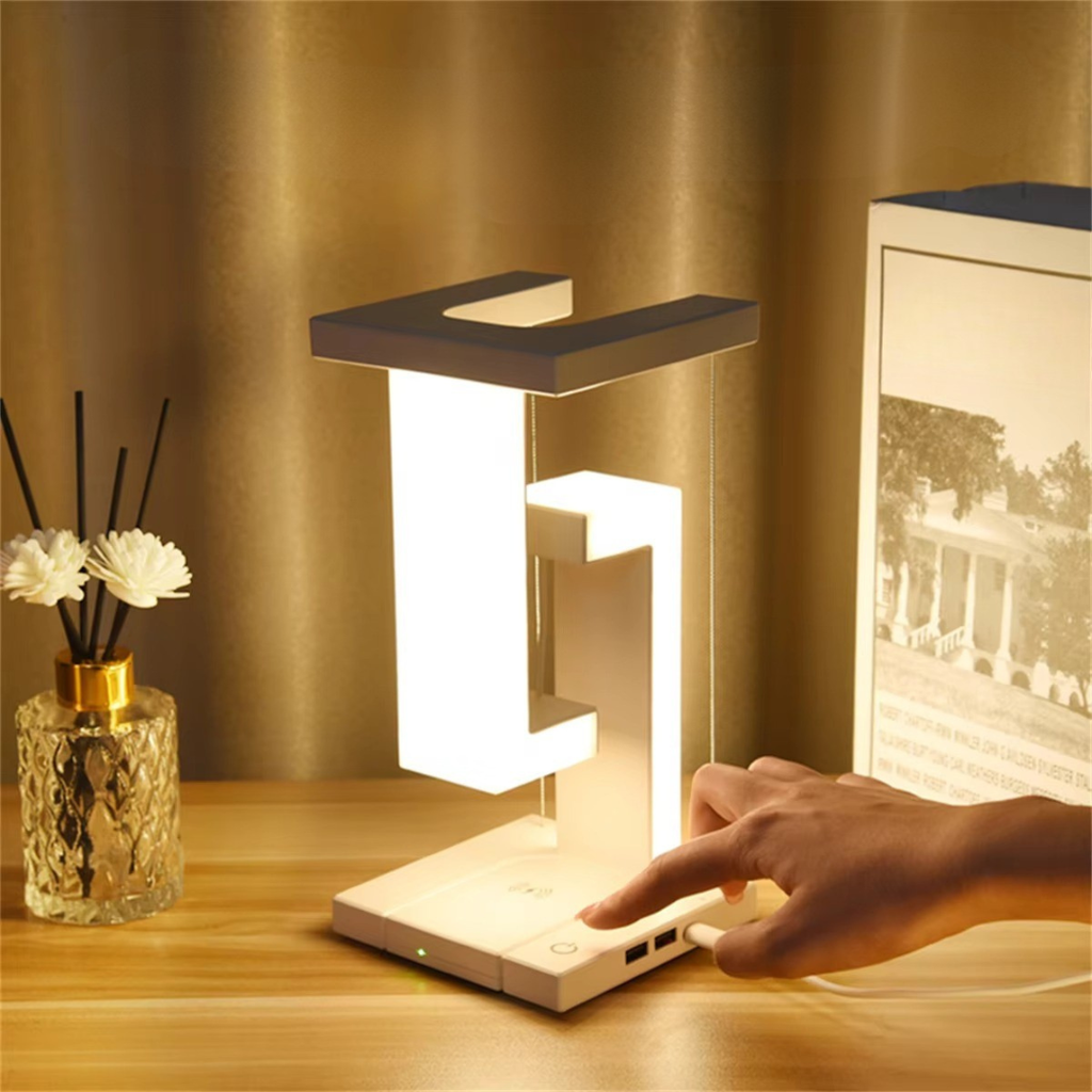 Levitating Desk Light Featuring Wireless Charging Pad For Modern Home Office Use Dimmable Brightness