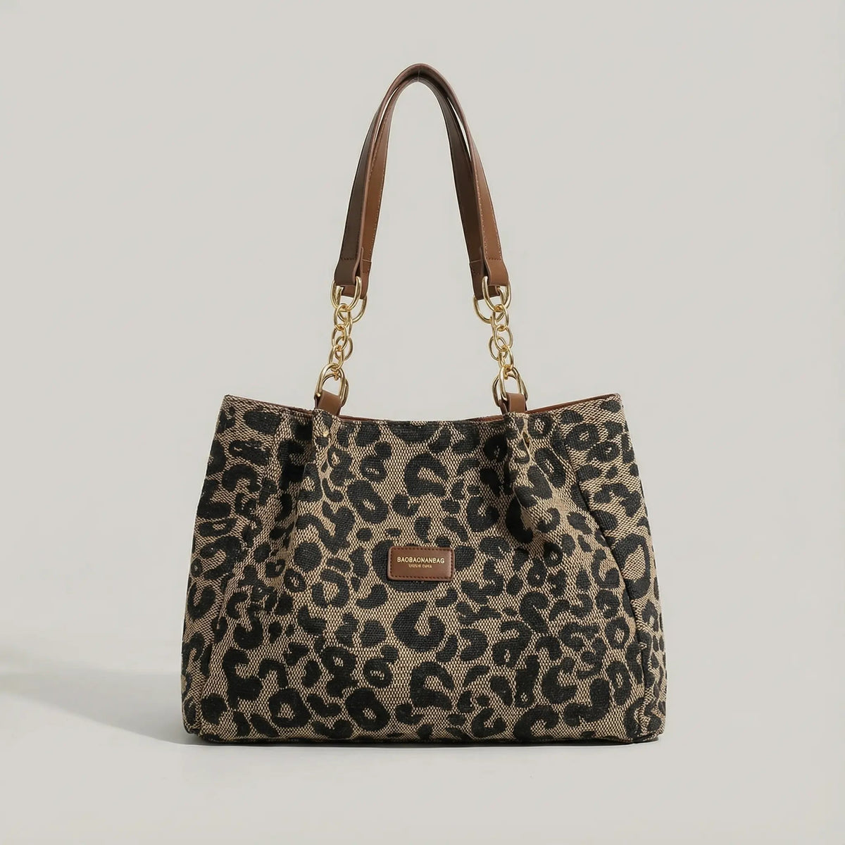 Bolso tote de lona con estampado de leopardo — Asas de cadena dorada y patrón marrón y negro