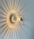 RadiantFlux Glass Wall Light With Rippled Sunburst Pattern And Gentle Ambient Glow