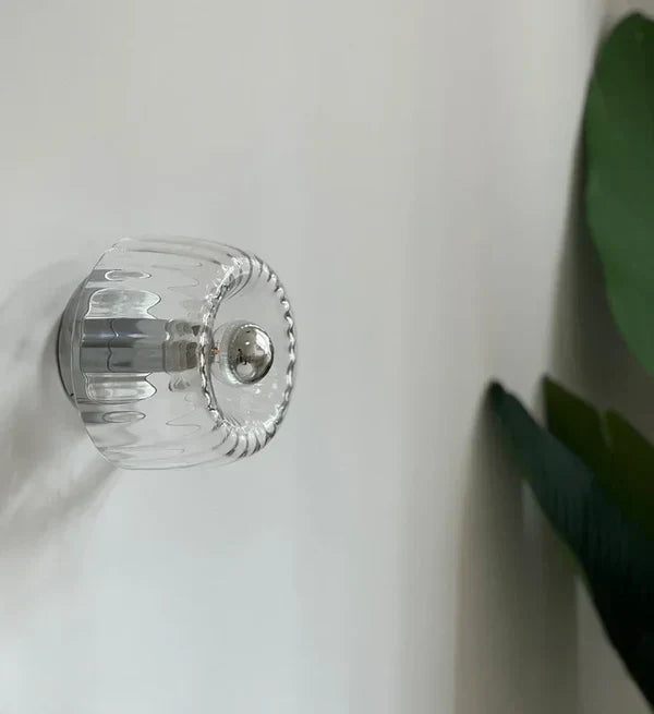 RadiantFlux Glass Wall Light With Rippled Sunburst Pattern And Gentle Ambient Glow