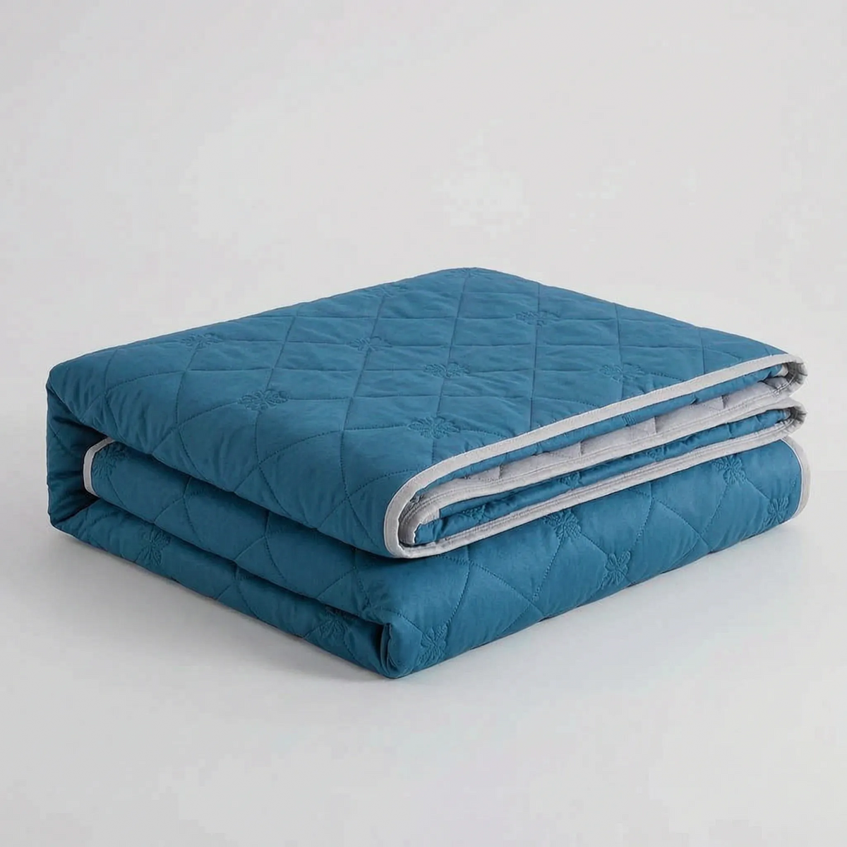 Couverture rafraîchissante matelassée en losanges Somniq – tissage léger et perméable –