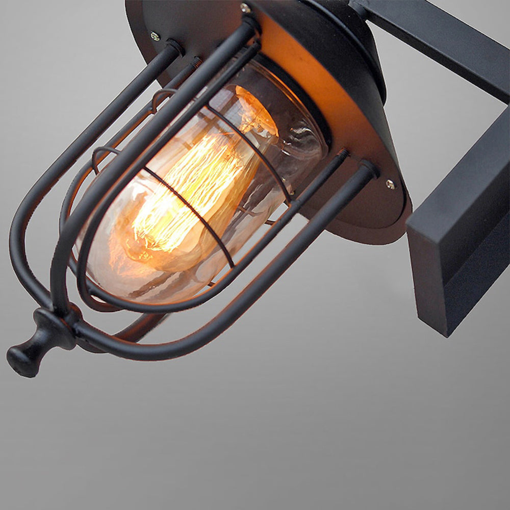 Caspian Lantern Exterior Wall Light With Clear Glass Shade And Protective Cage For Outdoors