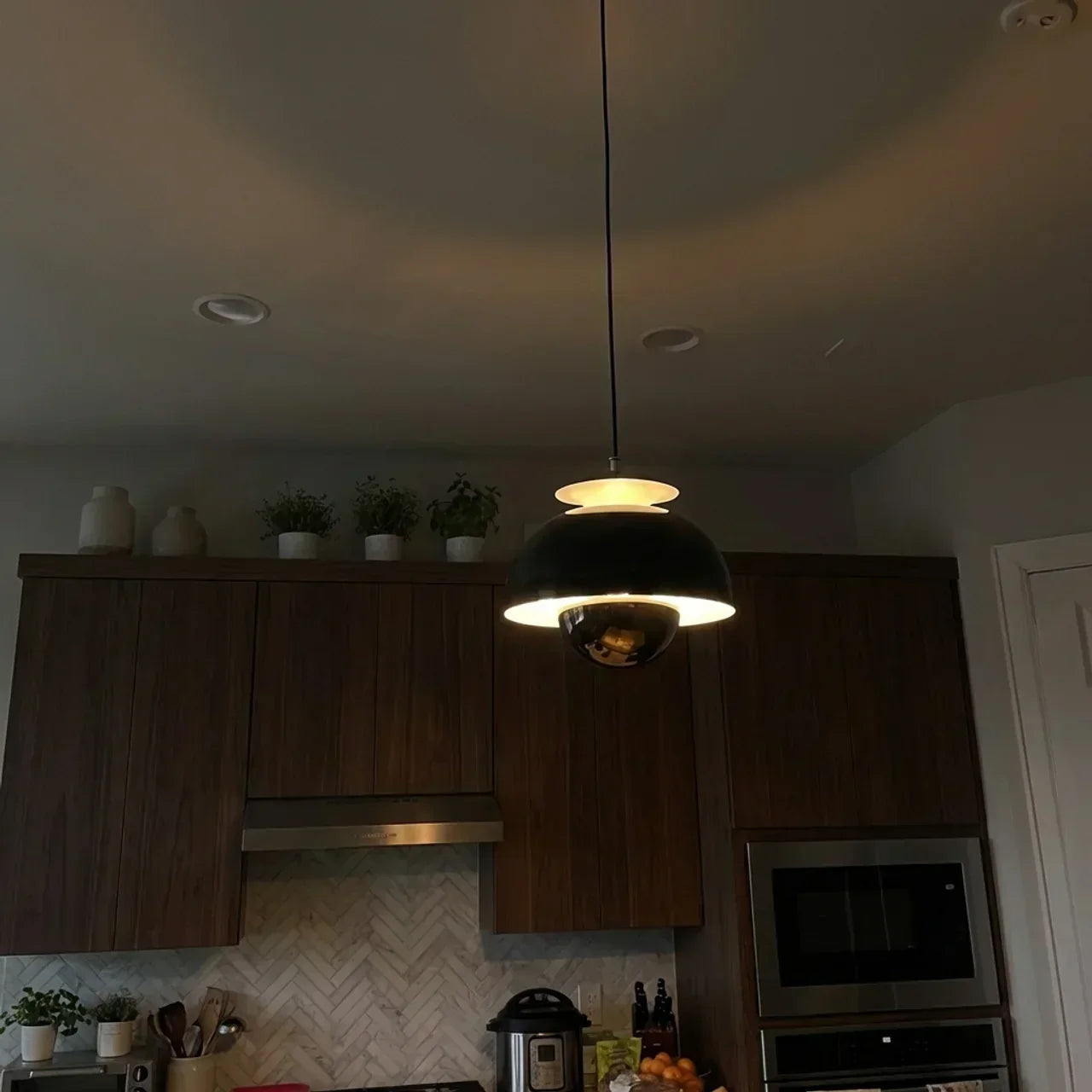 Soft Ambient Orb Pendant Light With Smooth Spherical Design For Modern Home Interiors