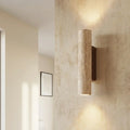 Wall Lamp In Vertical Design Using Travertine Stone With Led Lights Pointing Up And Down