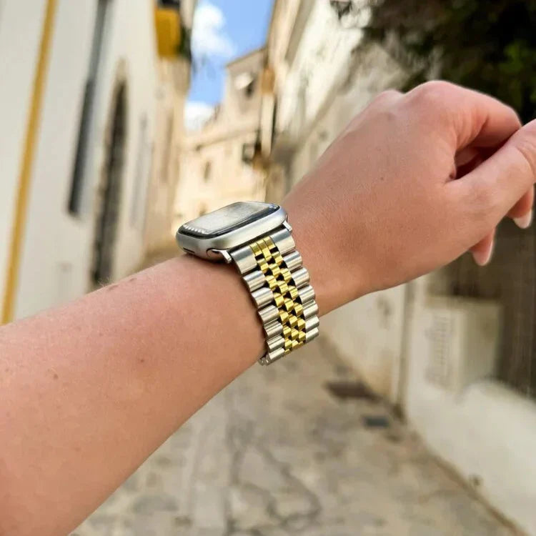 Jubilee-rem i stål til Apple Watch — sølv og guld, karakteristisk leddesign