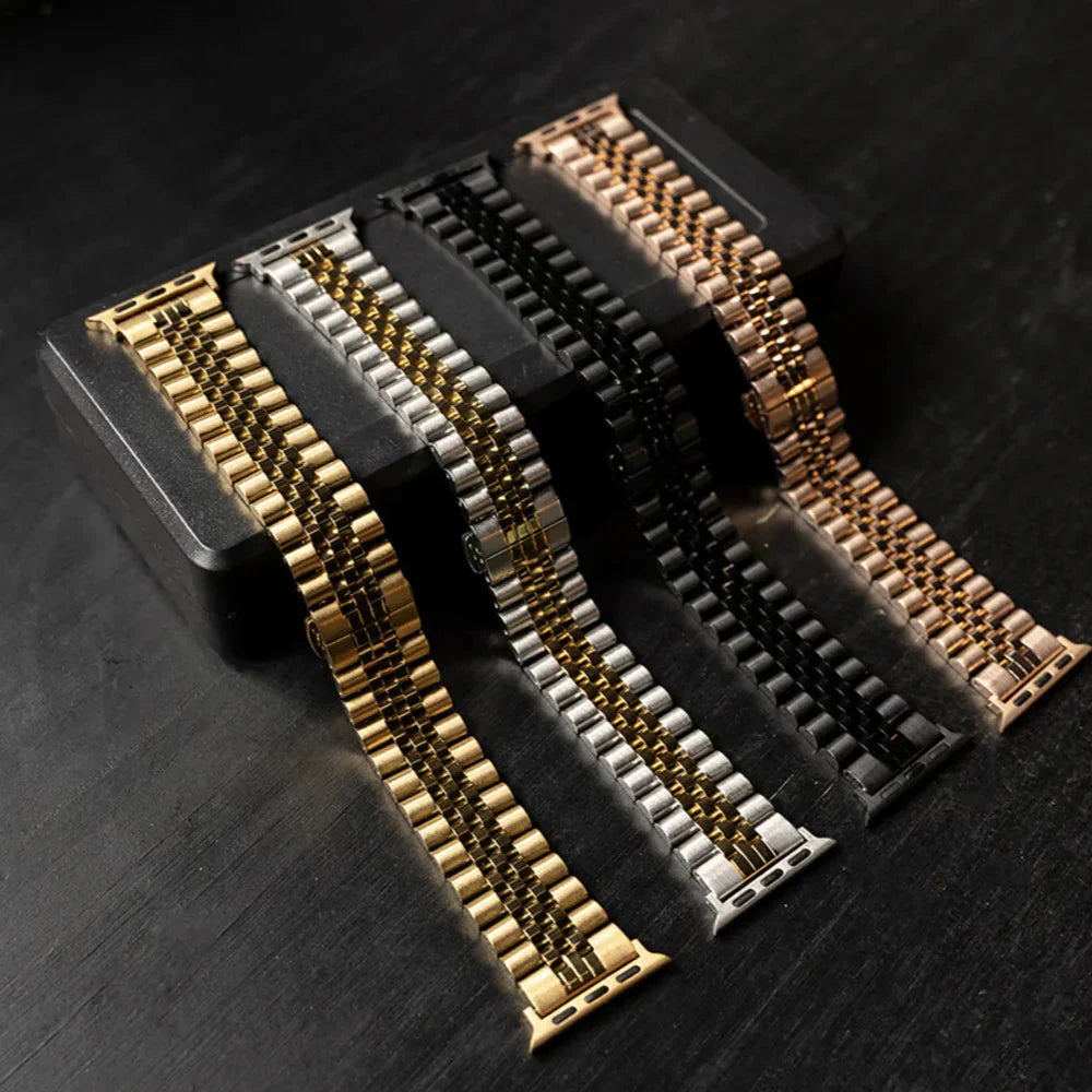 Jubilee-rem i stål til Apple Watch — sølv og guld, karakteristisk leddesign